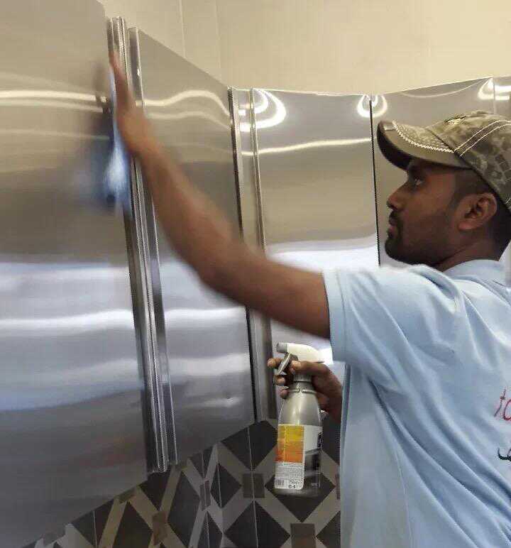 Person cleaning kitchen